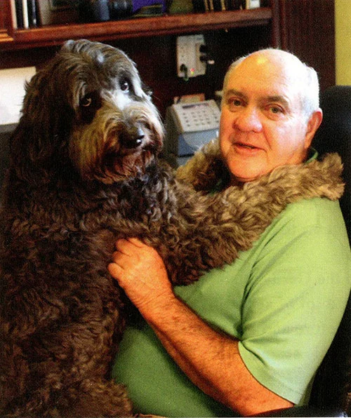 Al Gordy with "Smooch" - his certified therapy dog.